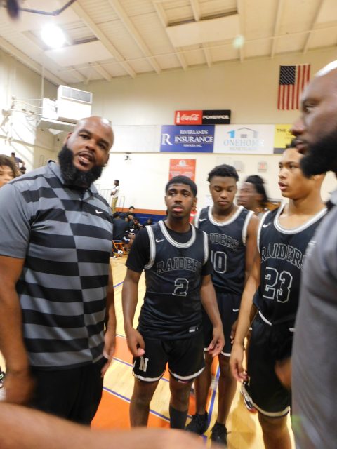 Northwest coach Mark Cashmere as the Raiders in the state playoffs