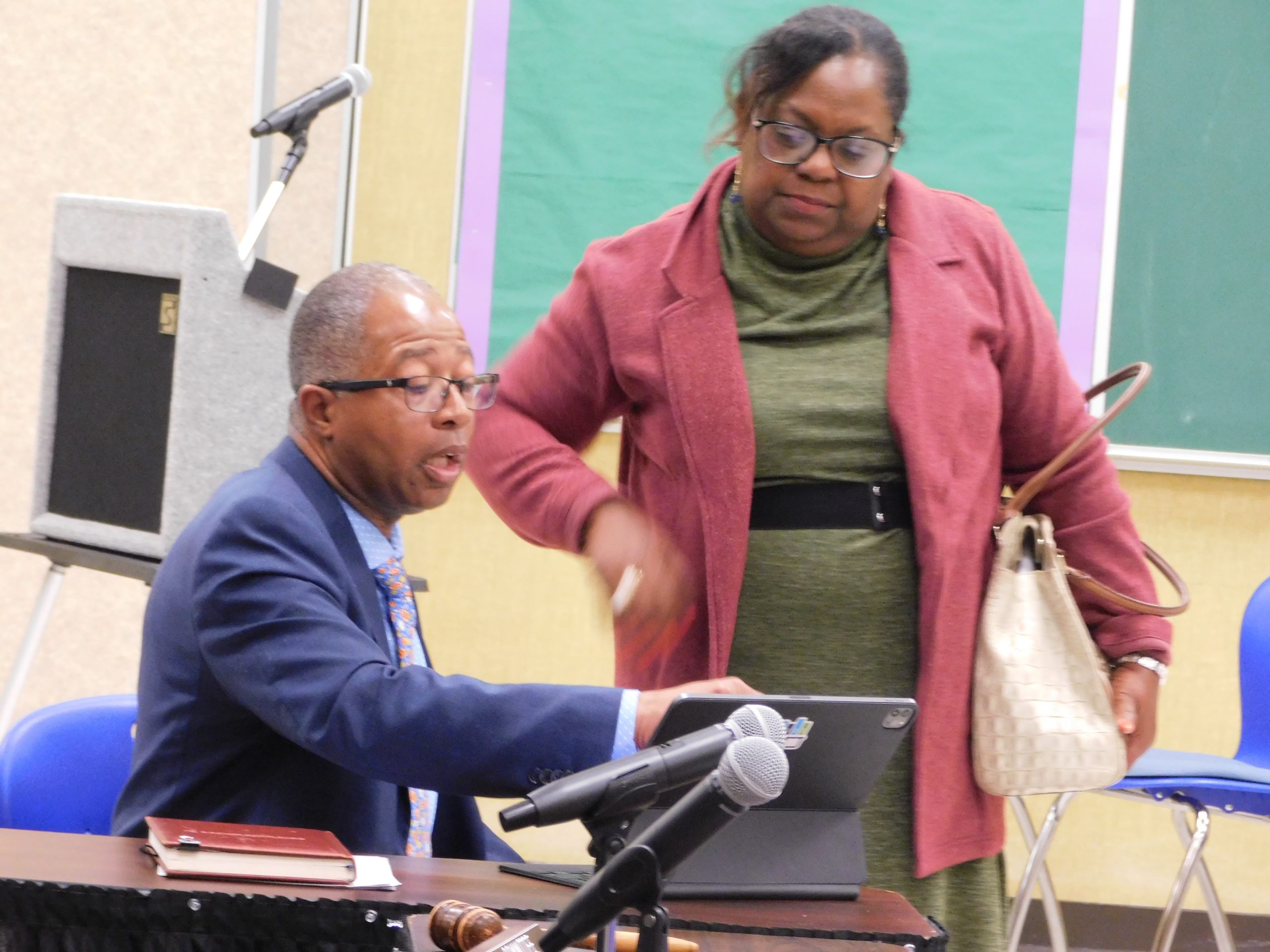 St. Landry Parish School Superintendent Patrick Jenkins reviews data with Willie Singleton Guillory of the St. Landry Federation of Teachers.